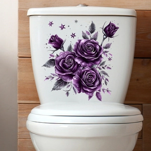 Detail of purple rose and star floral decal applied on white ceramic toilet tank surface