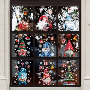 Christmas window decals with Santa Claus and reindeer on a black framed window glass