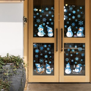 Festive Christmas window decals featuring blue snowmen and snowflakes for glass decoration