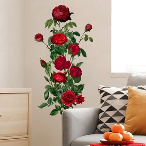 Detailed view of red rose wall stickers on a minimalist living room wall with a sofa
