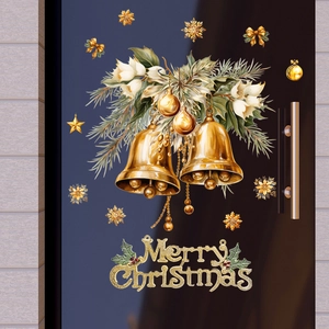 Detail of Christmas window clings with golden bells, snowflakes and Merry Christmas text