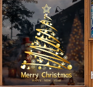 Détail de stickers vitres sapin de Noël doré avec texte Merry Christmas sur verre