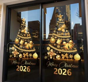 Detail of golden Christmas tree window stickers with Merry Christmas 2026 lettering