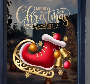 Detail of a festive red Christmas boot window sticker with golden bells and lettering