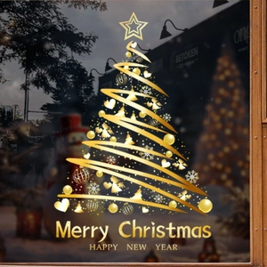 Sticker de sapin de Noël doré avec étoiles et flocons sur une vitrine en verre