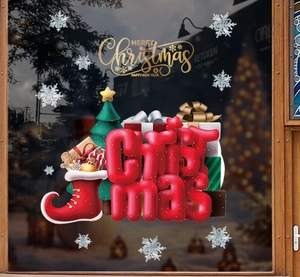 Close-up of gold Merry Christmas window static stickers with gift box and tree decals