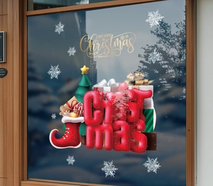 Detailed view of Christmas stocking and snowflake static window stickers on glass