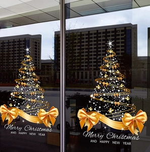 Golden spiral Christmas tree window decal with bow and festive holiday lettering