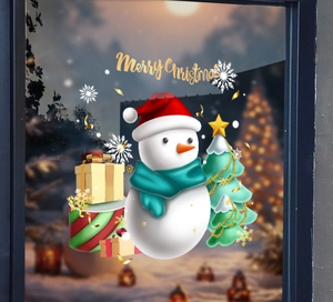 Close-up of snowman and Christmas tree window stickers with golden Merry Christmas text
