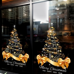Golden Christmas tree window decals with elegant ribbons and bows for holiday glass decoration
