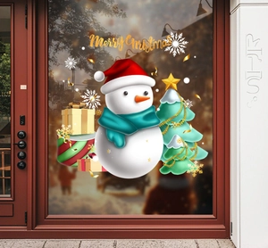 Detail of Christmas window stickers featuring snowman and tree on blurred glass