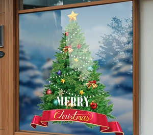 Detail of Christmas tree static cling with Merry Christmas text on a glass door