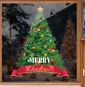Detail of Christmas tree window sticker with Merry Christmas ribbon and festive ornaments