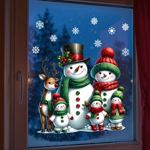 Detailed view of cartoon snowman family and reindeer static stickers on a snowy window