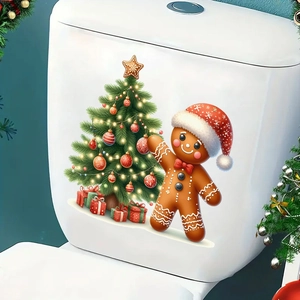 Détail de stickers de bonhomme en pain d'épices et sapin sur un réservoir de toilette