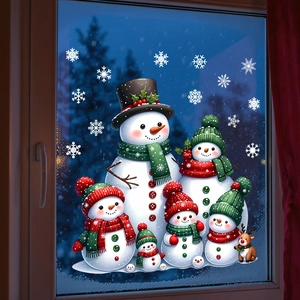Detailed view of Christmas snowman family and snowflake static window clings on glass