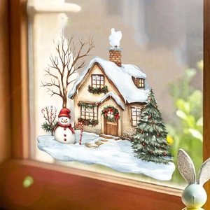 Detailed view of watercolor Christmas window stickers with snowman and snowy cabin