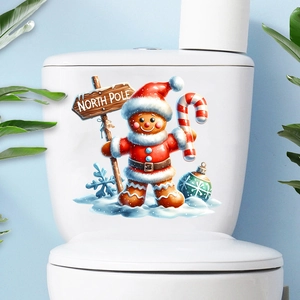 Detail of Christmas gingerbread man wall decal on white surface with North Pole sign