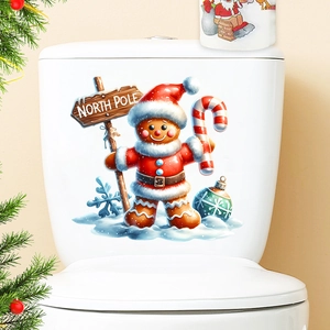 Close-up of festive gingerbread man toilet seat sticker with North Pole sign detail