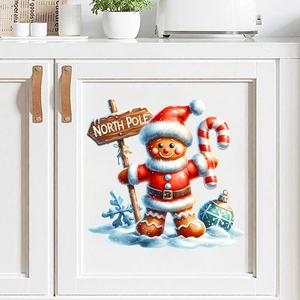 Christmas gingerbread man wall sticker with North Pole sign on a white kitchen cabinet door