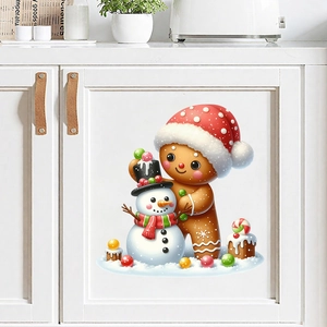 Sticker de Noël montrant un bonhomme de pain d'épices et un bonhomme de neige sur meuble