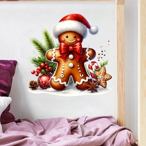 Detail of Christmas gingerbread man wall sticker with festive pine branches and red berries