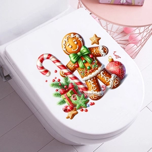 Gingerbread man and candy cane Christmas decals applied on a white toilet lid cover