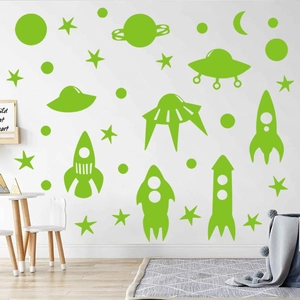 Luminous green space wall stickers with rockets, planets, and stars for kids' room