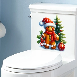 Detail of Christmas gingerbread man and tree self-adhesive decals on a white surface