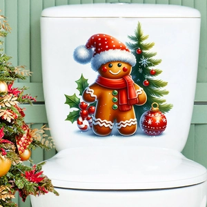 Detailed Christmas gingerbread man and tree self-adhesive decals on a white toilet tank