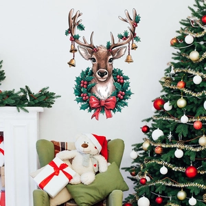 Detail of Christmas reindeer wall sticker with gold bells and festive wreath on white wall