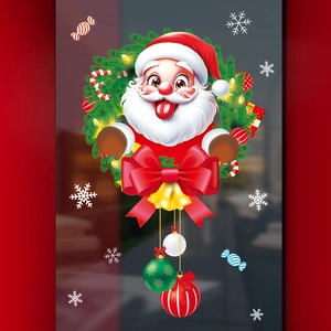 Détail de l'autocollant de fenêtre Père Noël avec couronne verte et nœud rouge sur vitre