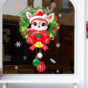 Sticker de Noël pour fenêtre avec renne dans une couronne verte et flocons de neige