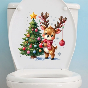 Detailed view of festive Christmas reindeer and tree stickers on a white toilet lid