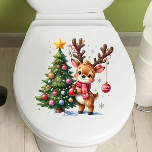Detail of Christmas reindeer and tree decal on a white ceramic toilet lid cover