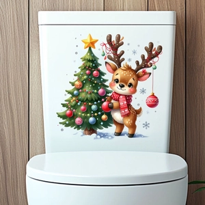 Close-up of Christmas tree and reindeer wall stickers on a white toilet tank