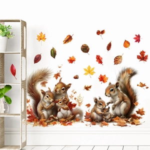 Detailed view of autumn squirrel and maple leaf wall stickers on a clean white living room wall
