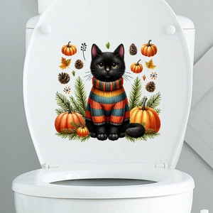 Close-up of a cat in striped sweater with pumpkins and maple leaves on a white toilet lid