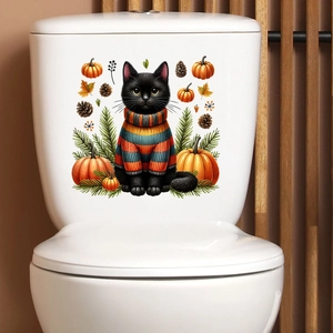 Detail of waterproof cat and pumpkin wall sticker on white ceramic toilet tank
