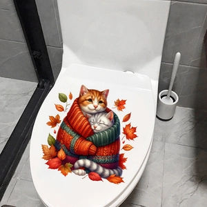 Detail of waterproof toilet sticker featuring cute cats in sweaters and autumn maple leaves