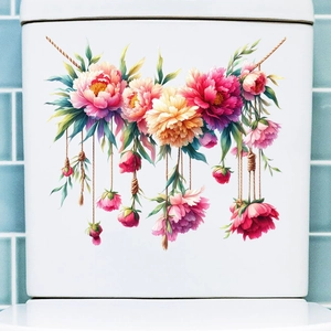 Dettaglio di adesivi murali floreali con peonie rosa e foglie verdi su superficie bianca