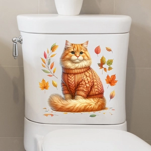 Detailed view of autumn cat sticker with maple leaves on a white ceramic toilet tank