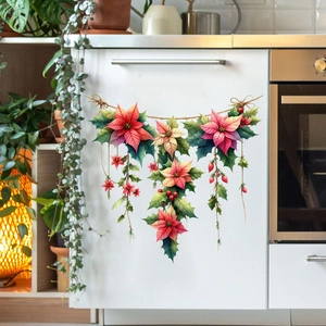 Dettaglio di adesivi murali con poinsettia appesi su un mobile da cucina bianco
