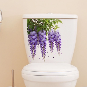 Detailed view of wisteria flower wall stickers applied on a white ceramic toilet tank