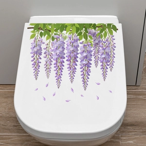Detail of waterproof purple wisteria flower decals applied on a white toilet lid