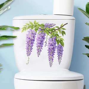 Detailed wisteria flower decal applied to a clean white toilet tank in a modern bathroom