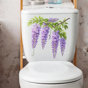 Detail showing purple wisteria flower stickers applied on a white toilet tank surface