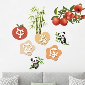 Close-up of decorative panda and bamboo wall stickers with Chinese blessing characters