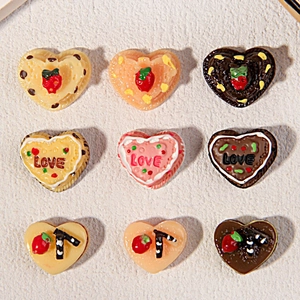 Detailed grid view of heart-shaped resin cake charms with mini strawberry and LOVE texture