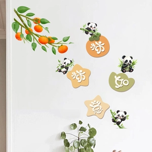 Detail of pandas and persimmon branches waterproof wall sticker on a white bedroom wall
